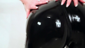 Redhead MILF in tight latex pants pleasures herself on camera