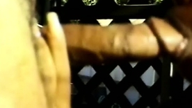 African-American woman gives elderly man a handjob in an outdoor setting