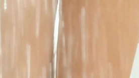 Kelly Brook, a busty British model, poses seductively here a taxi