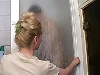 Mature mom and her son on the top of the shower