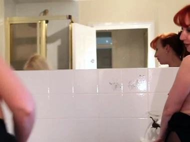 Red-haired beauties indulge in sensual bathroom encounter