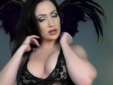 Angela Summers in black boots and lace stockings