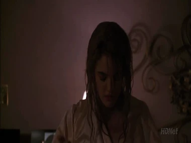 Drew Barrymore connected with a passionate embrace with a man on the exterior of a vehicle