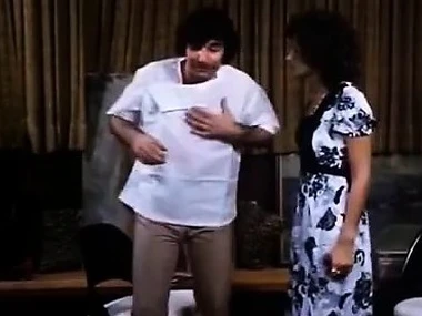 Linda Lovelace and Harry Reems alongside a vintage porn video featuring a murkiness giving a deep blowjob