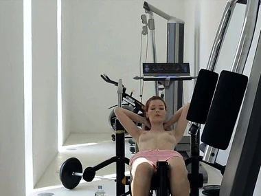 Mia Sollis, a fiery redhead teen, showcases her fitness routine added to intimate moments around this softcore pellicle