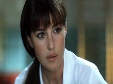 Monica Bellucci's stunning decolletage beside a revealing black dress