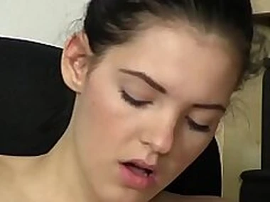 Ponytailed teen cutie rubs her pussy with a dildo